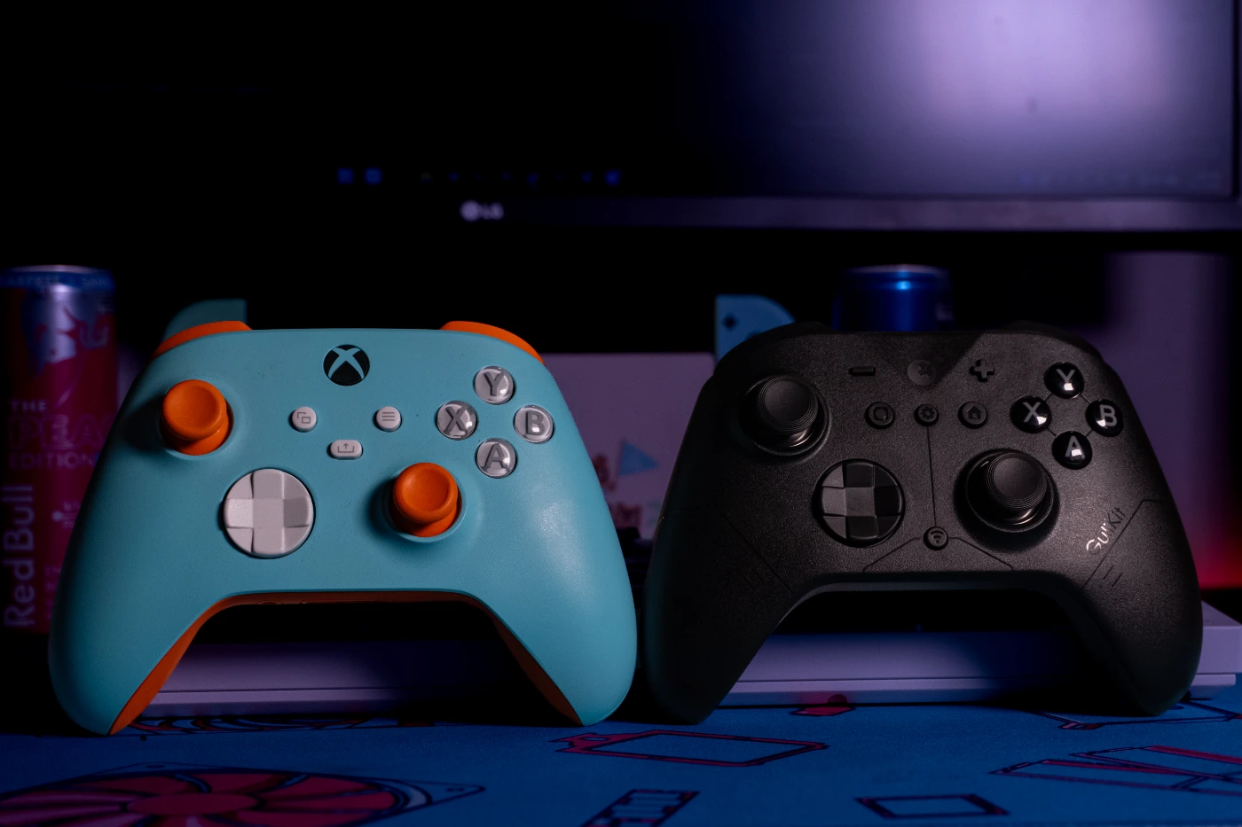 Side-by-side front-facing view of the XBOX Design Lab controller on the left, and the GuliKit ES MAX controller on the right.